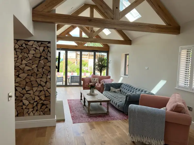 Vaulted ceiling and oak king trusses give this modern extension a traditional feel: Swipe To View More Images