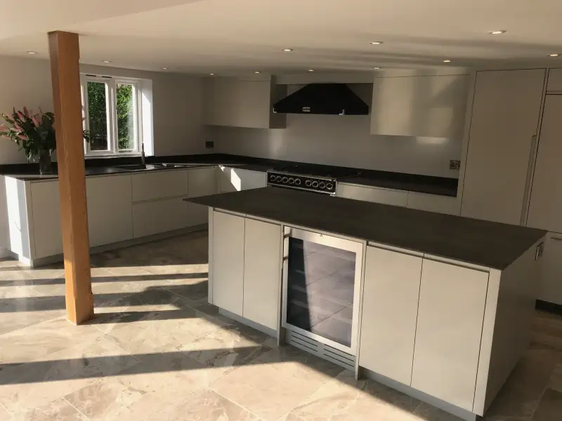 Simple and elegant modern kitchen in a traditional thatched cottage: Swipe To View More Images